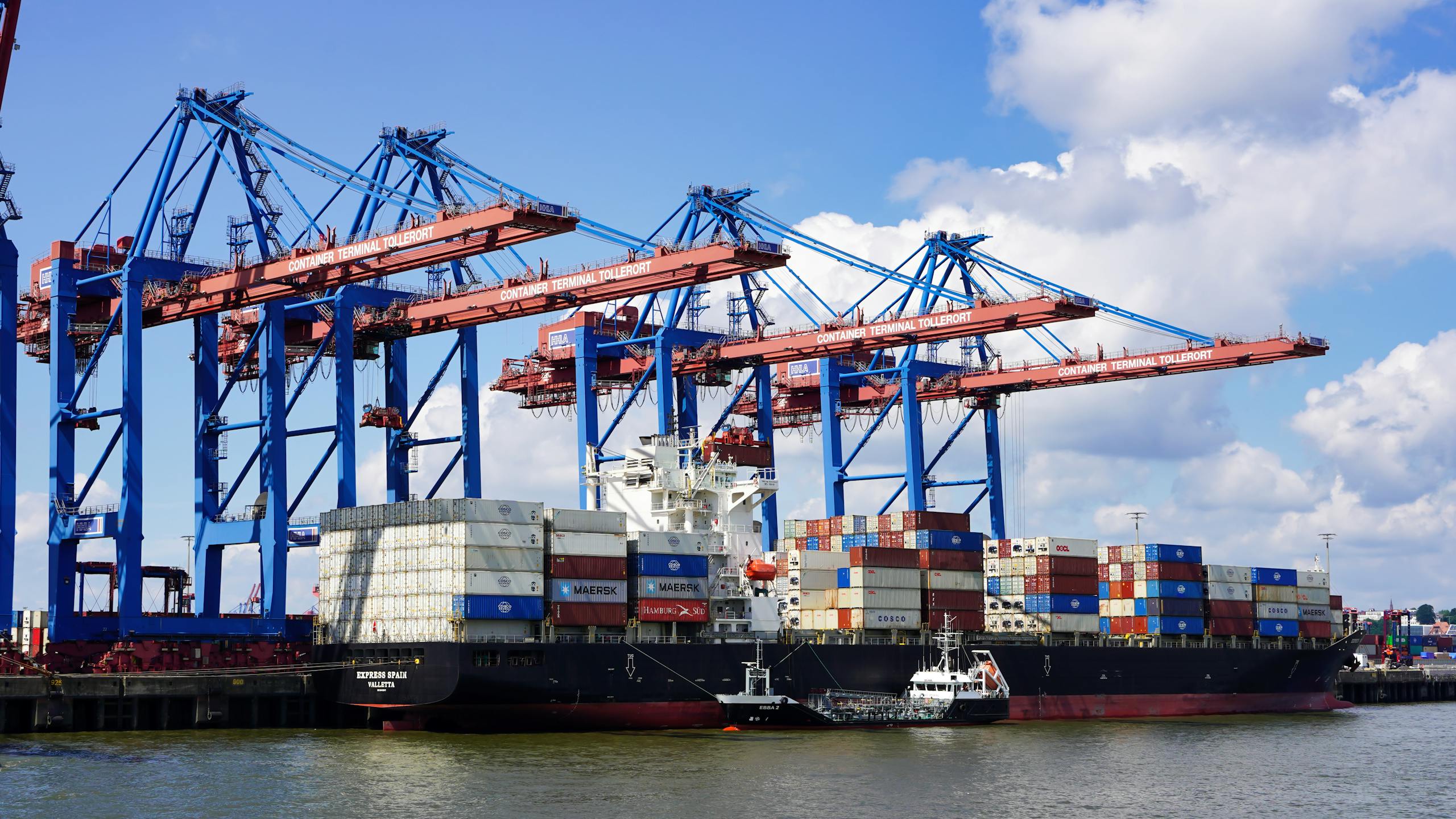 A large container ship at Hamburg's Container Terminal Tollerort loading and unloading.